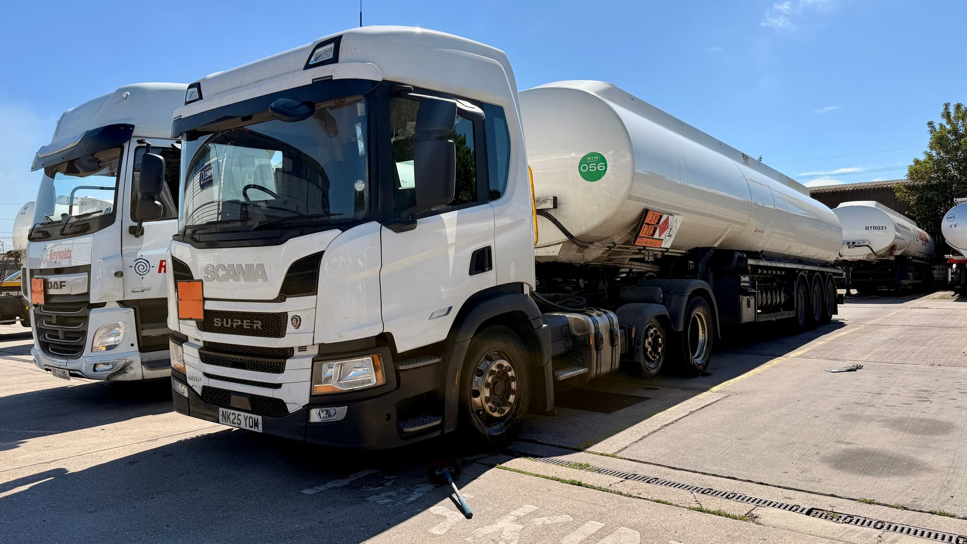 Commercial fleet vehicles in a working yard