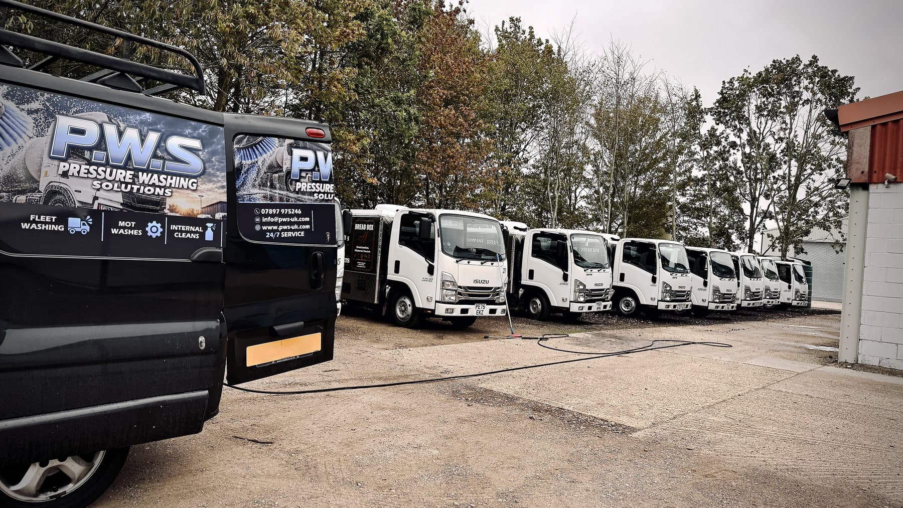 PWS van beside a line of commercial catering vehicles during an on-site fleet wash