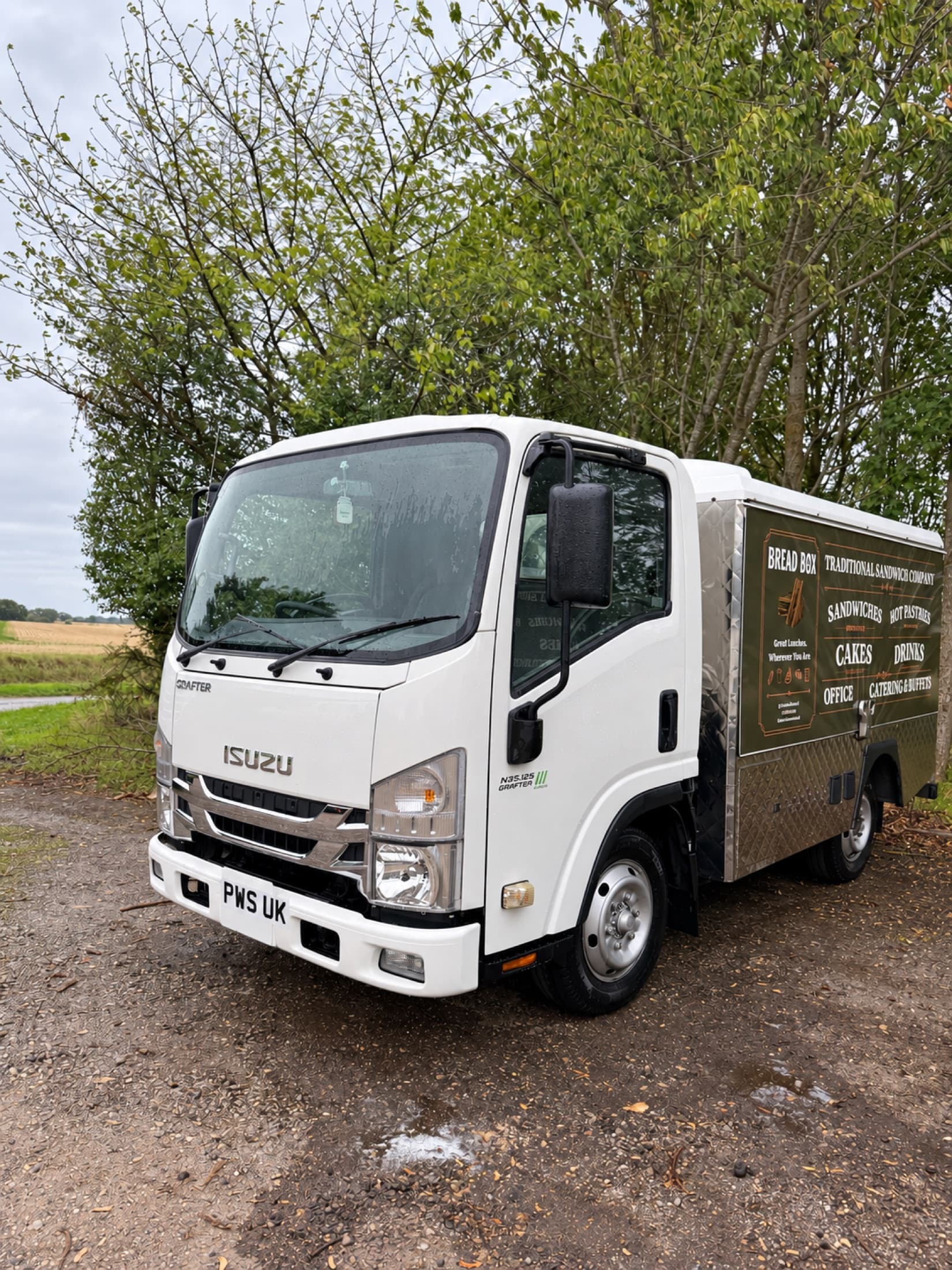 Professionally cleaned white commercial vehicle photographed after washing