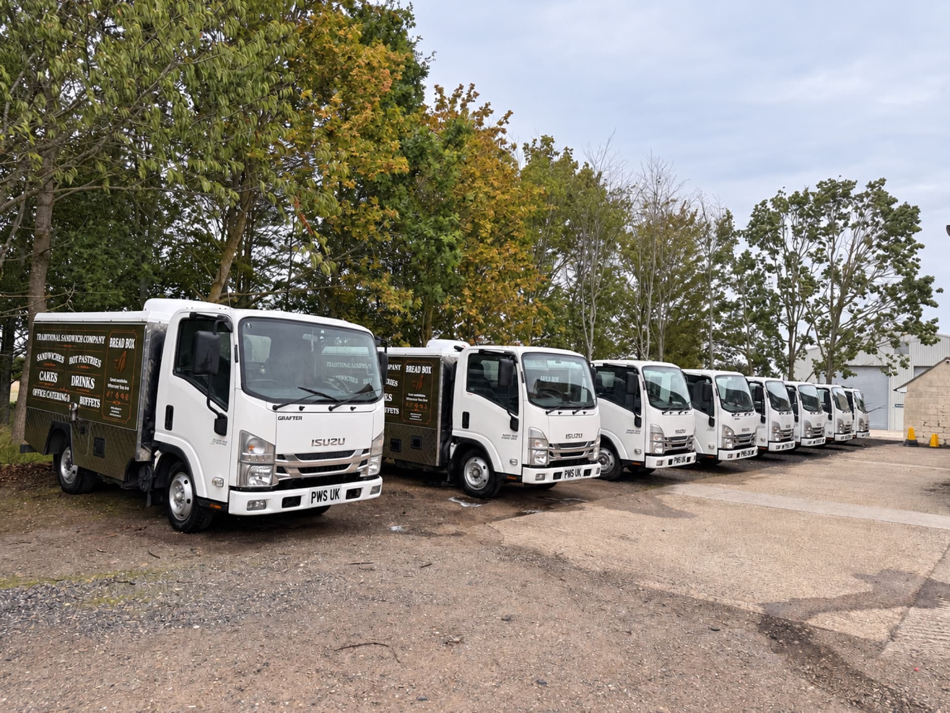 Line-up of freshly cleaned commercial vehicles following a PWS fleet wash