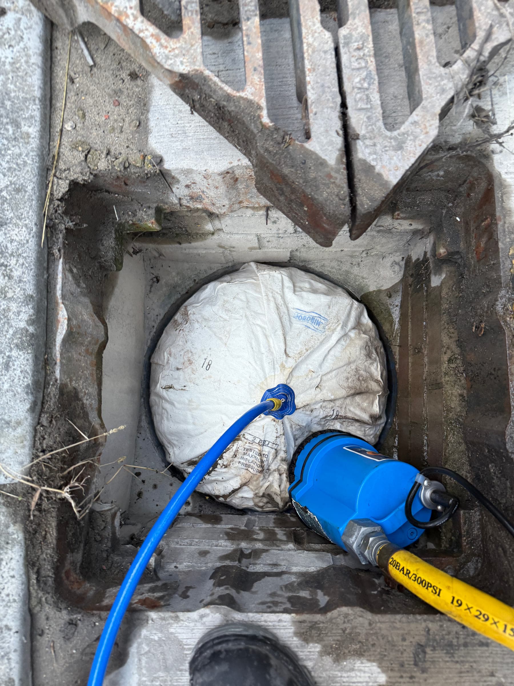 Drain bung and recovery pump used for wash water containment