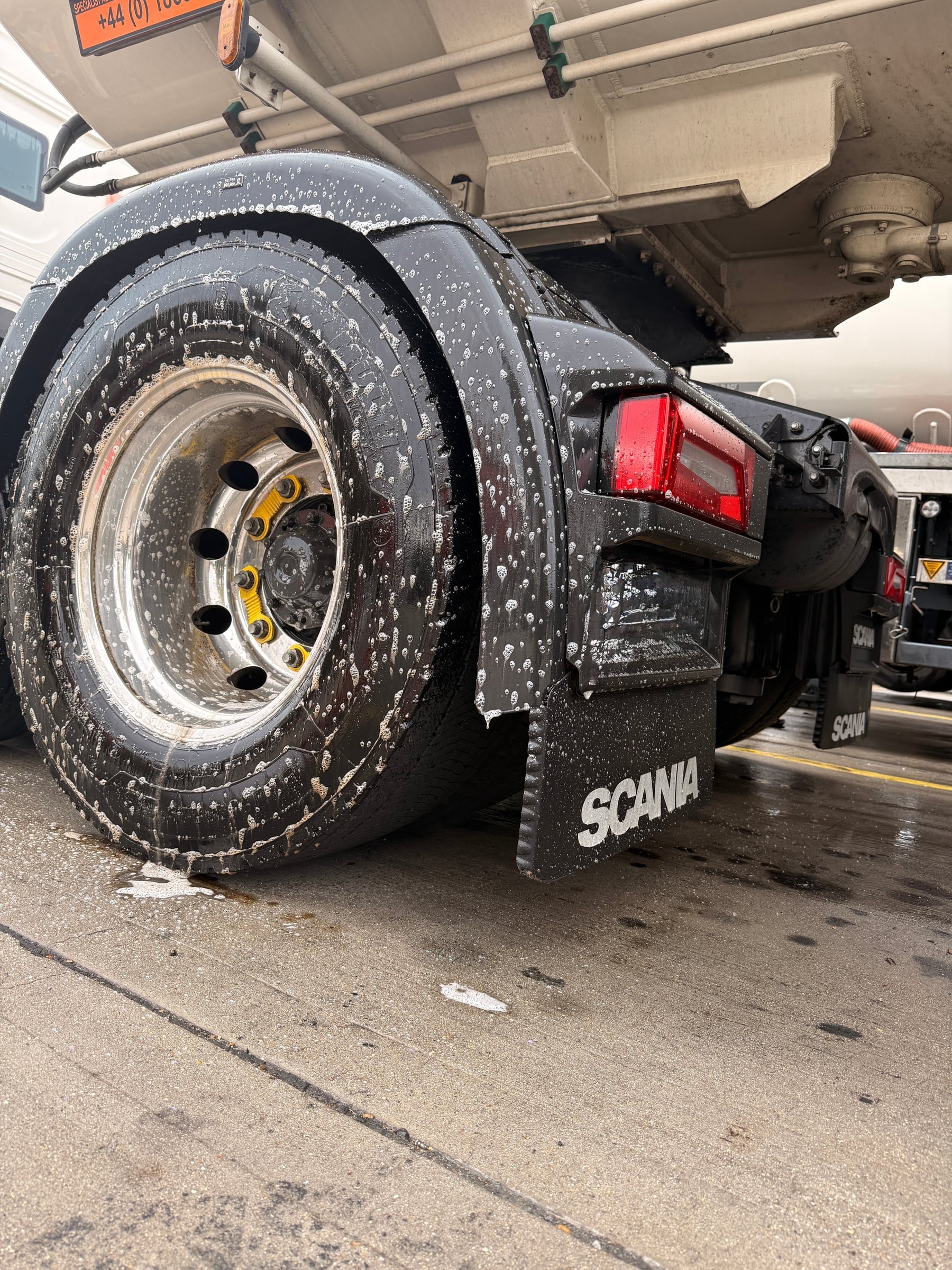 Commercial vehicle wheel and lower bodywork during detailed cleaning