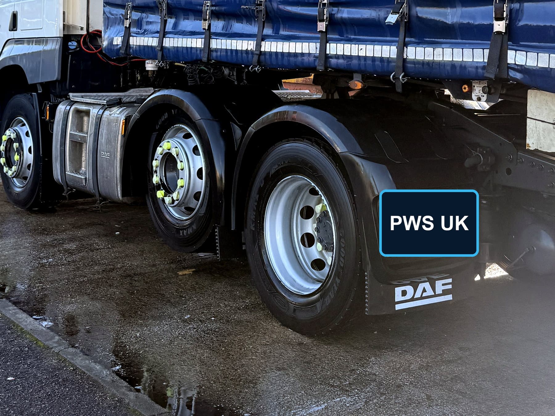 Commercial truck wheel and lower-body area during cleaning