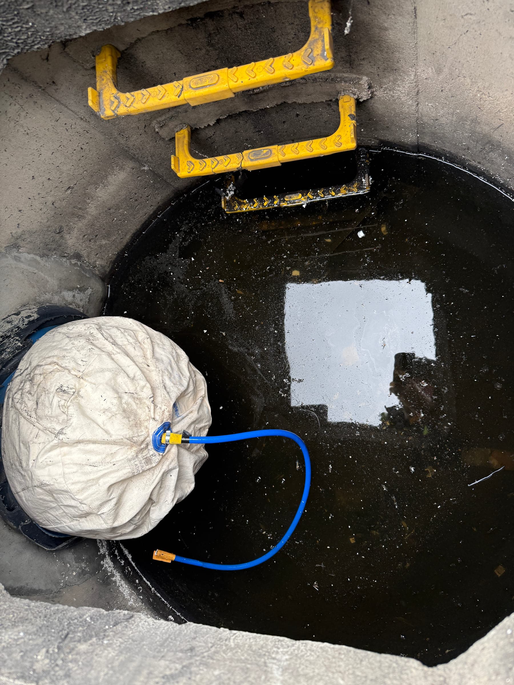 Contained wash water and recovery hose at a drain