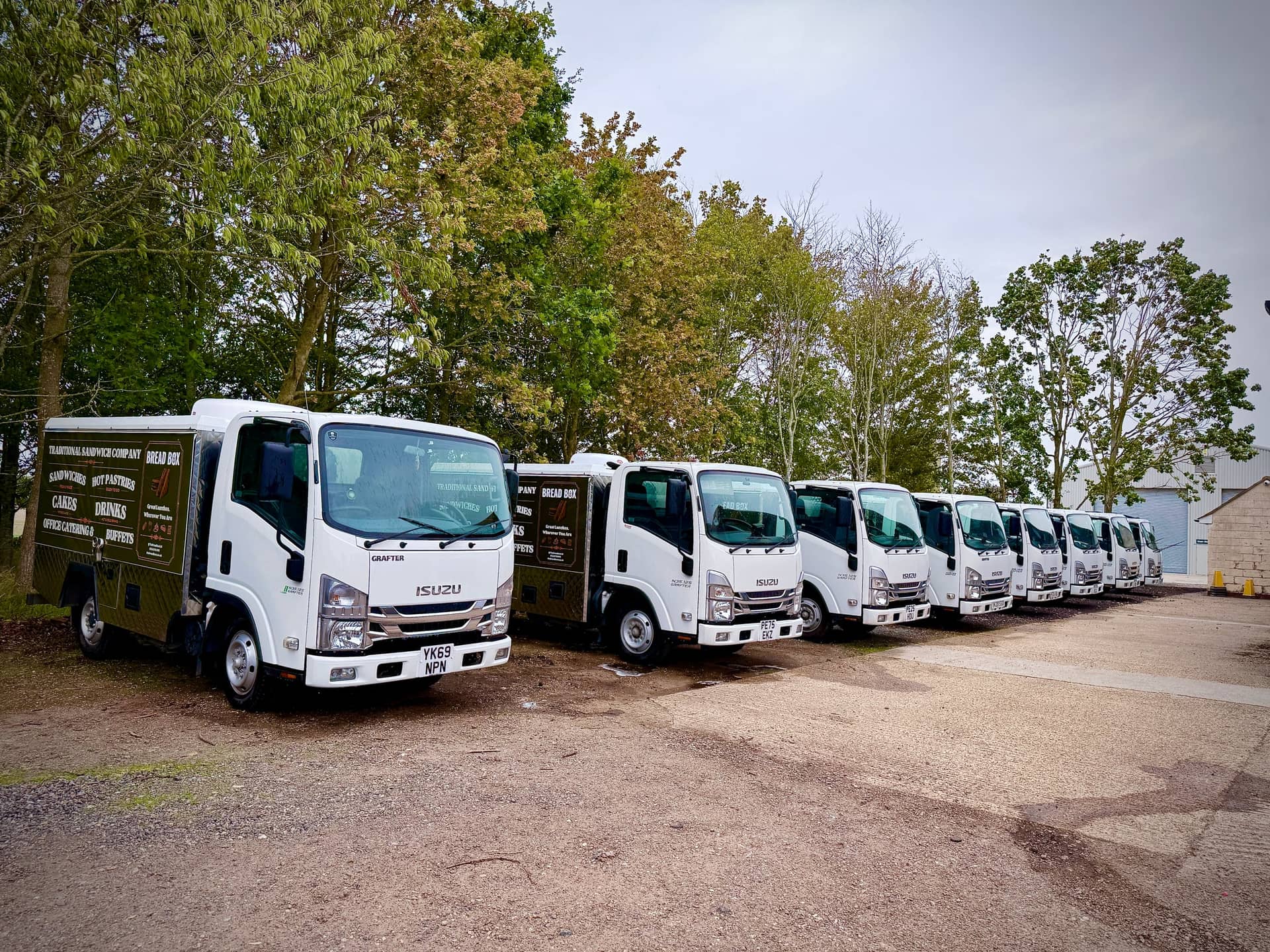 Clean commercial delivery fleet lined up after a PWS wash