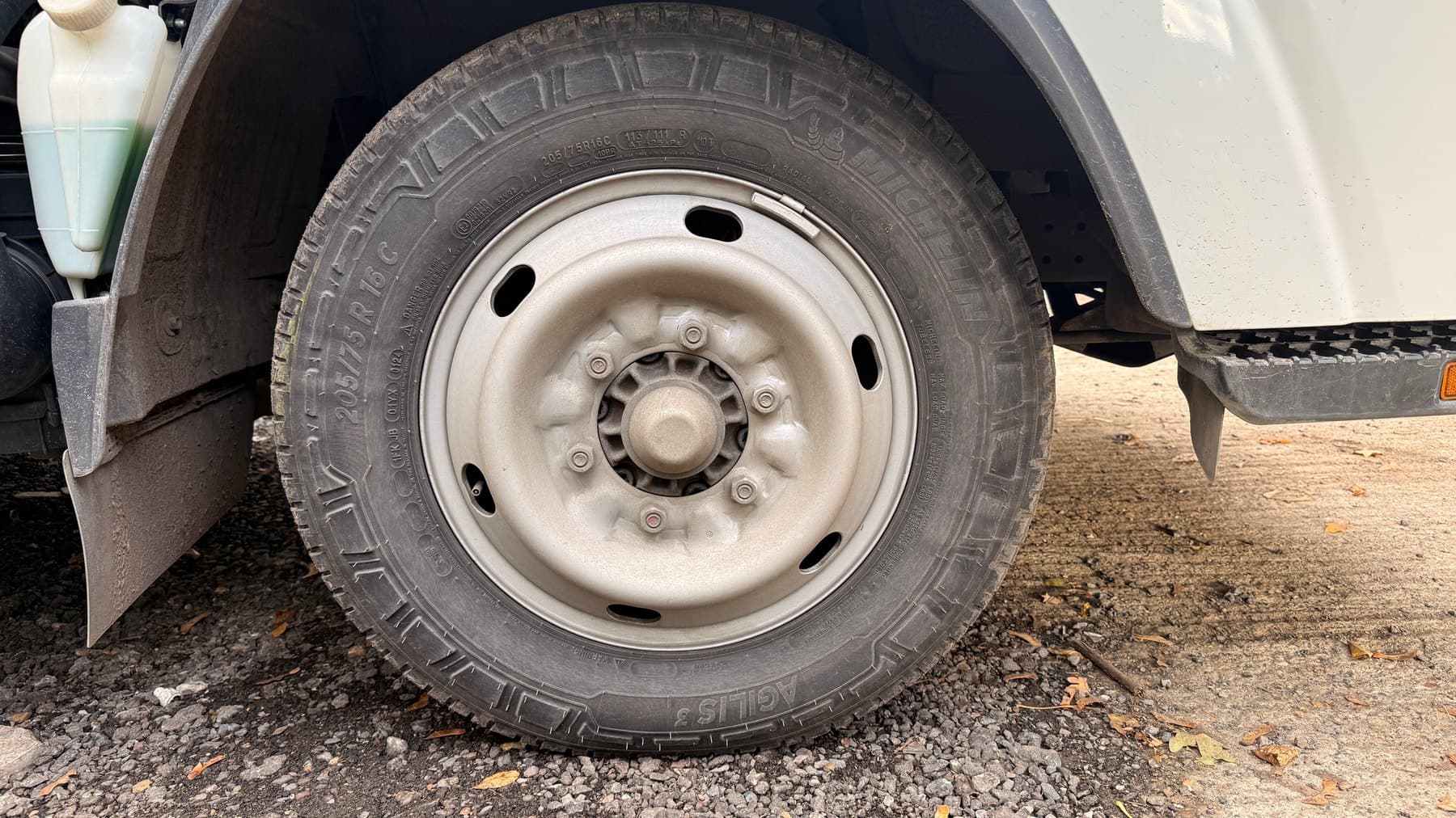 Commercial vehicle wheel with road grime before cleaning